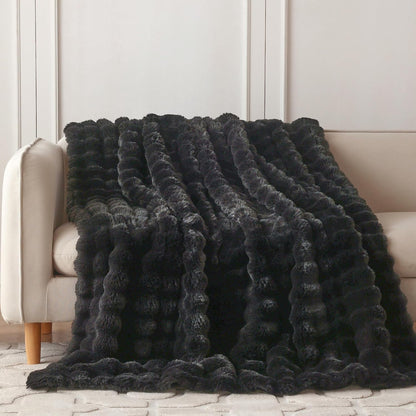 Heerlijk zachte, stijlvolle plaid die warmte, gezelligheid en elegantie samenbrengt.